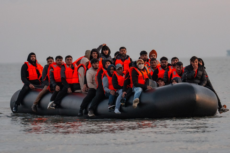 Migrants in a small boat crossing the English Channel.