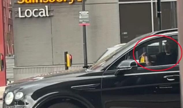 Gary Neville has been filmed appearing to use his phone while driving his £170K Bentley