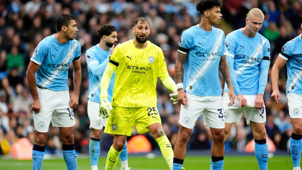 Manchester City goalkeeper Gianluigi Donnarumma rallying fans during a Premier League match.