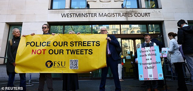 Activists demonstrate on the day Irish comedy writer Graham Linehan, who has been charged with harassment and criminal damage involving a transgender activist, appears at Westminster Magistrates' Court, in London, Britain, September 4, 2025. REUTERS/Jack Taylor