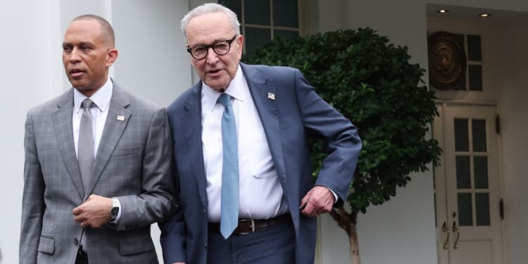 House Minority Leader Hakeem Jeffries and Senate Minority Leader Charles Schumer leave the White House following a meeting with President Donald Trump on Sept. 29, 2025, in Washington, D.C.