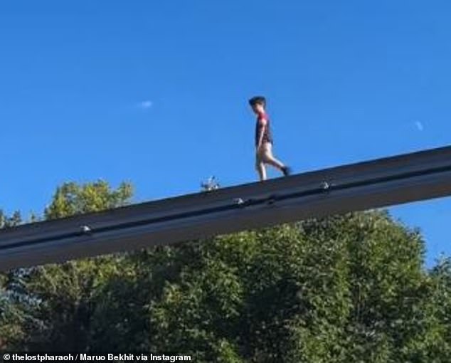 John Sampson says his 'dad instincts kicked in' the moment he saw the young boy teetering along the edge of the monorail