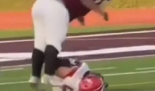 Kalamazoo Central High School has taken 'strong and decisive action' against one of their own junior varsity football players after he was seen jumping on top of a defenseless opponent