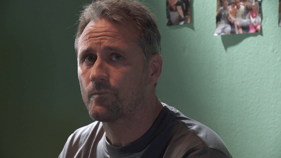 Man with serious expression.