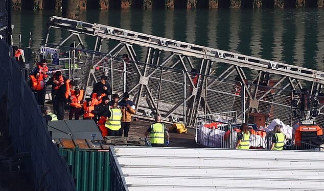 Migrants brought ashore at Dover after crossing the Channel over the weekend