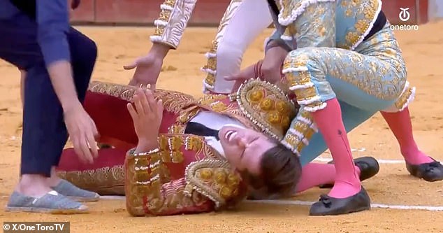 In disturbing footage he could be seen writhing on the ground after the goring