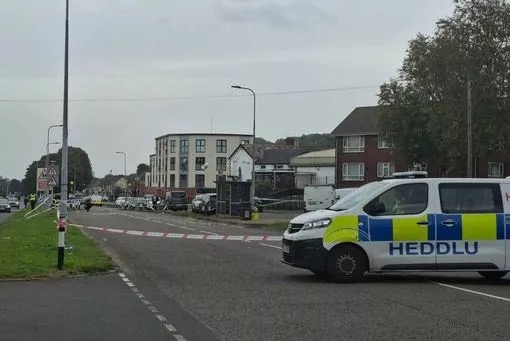 Police car at a scene where a car collided with pedestrians in Cardiff.