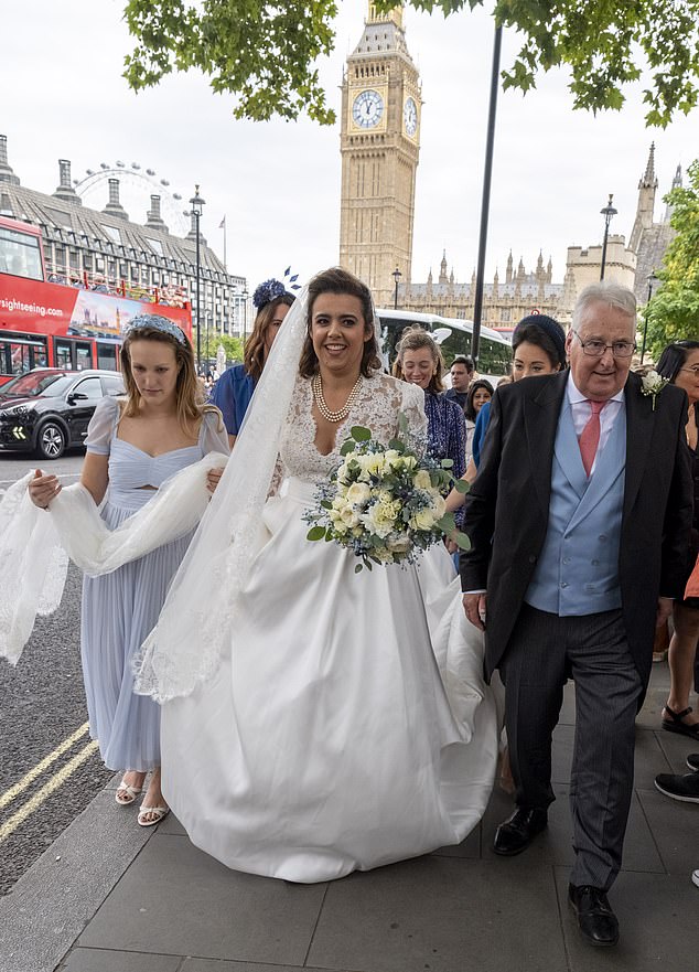 Emily Benn beamed as she arrived at the church with her father, Stephen, Viscount Stansgate