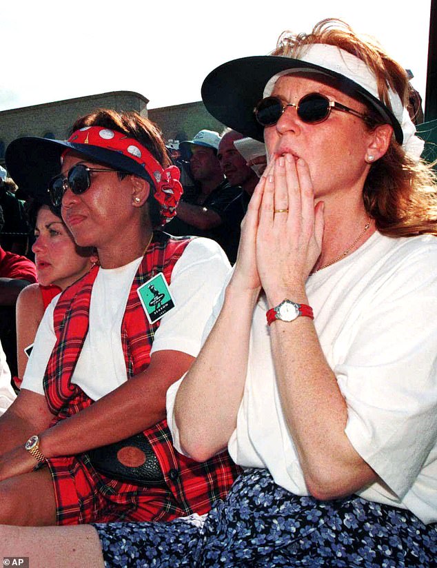 Sarah Ferguson, right, and Kultida Woods, mother of golfer Tiger, watch as he prepares to sink his final putt to win the Byron Nelson Classic on May 18, 1997, in Irving, Texas