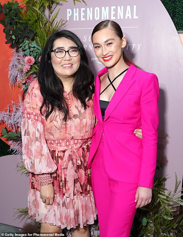She took a leave of absence from college to film in North Carolina in 2021, before the hugely popular show landed on Amazon a year later (pictured with The Summer I Turned Pretty author Jenny Han)