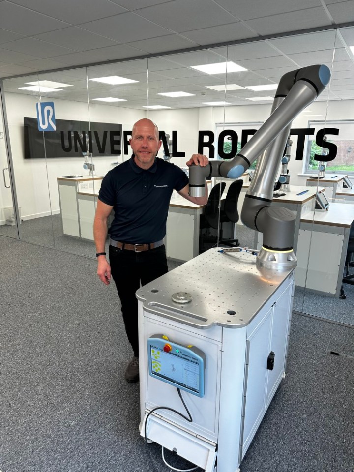 David Lievesley of Universal Robots with a robot arm.