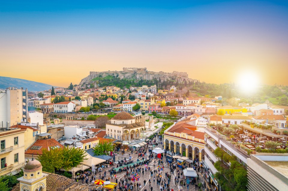 Monastiraki Square in Athens, Greece, with the Acropolis in the background.