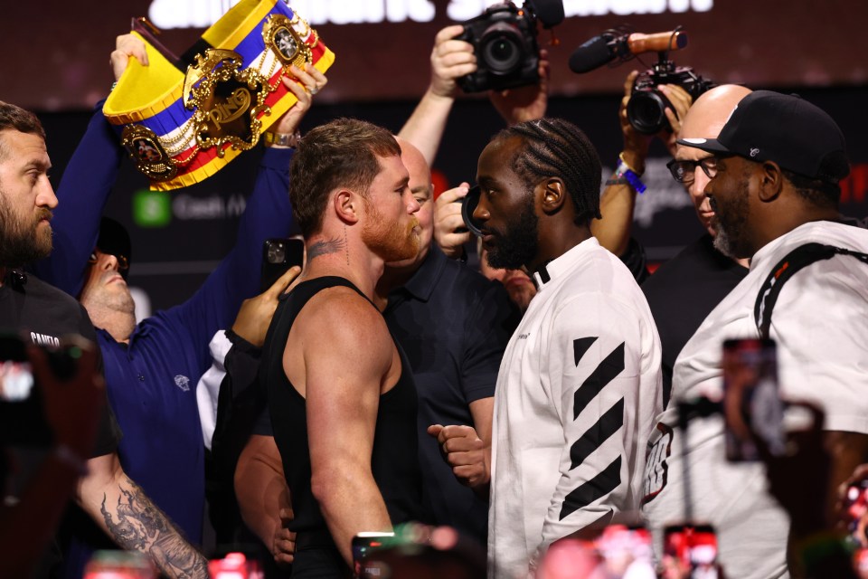 Canelo Alvarez and Terence Crawford face off at a press conference.