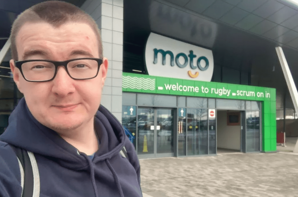 Rich James Cross in front of a Moto service station.
