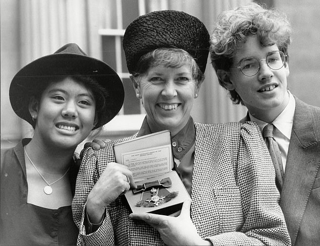 Sitting in the front room of his double-fronted, three-storey house in Ravenscourt Park in West London, a telly is conspicuous by its absence. 'I don't really watch it,' Kruger says, which feels remiss given his mother, Dame Prue Leith, is the star of The Great British Bake Off. Pictured: Dame Prue receives her OBE with her son (right) and her adopted daughter Li-Da Kruger
