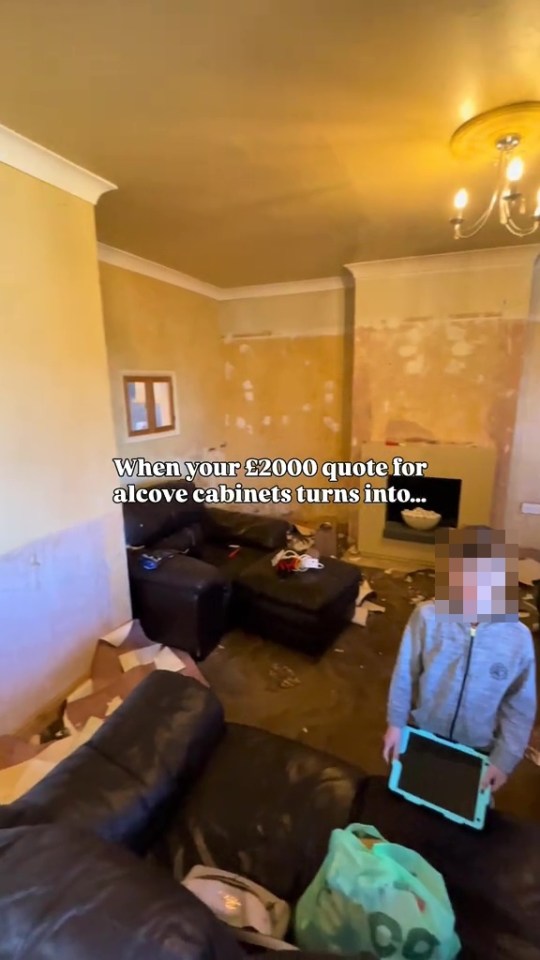A messy living room during a DIY alcove cabinet renovation.