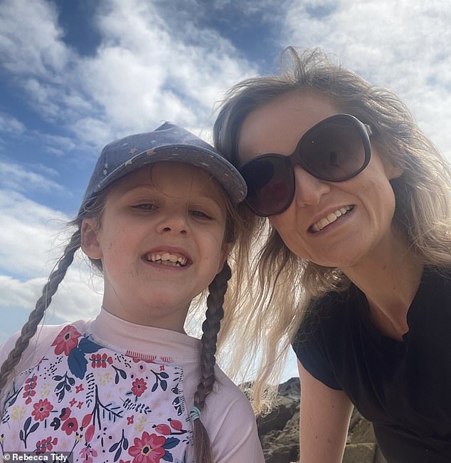 The selfie Rebecca took with her daughter on the beach, which prompted police to investigate her for 'harassment'