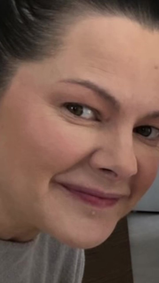 Close-up of a woman's smiling face.