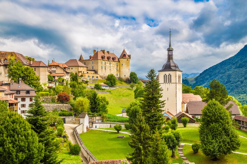 View of Gruyères, Switzerland, with its medieval castle and church.