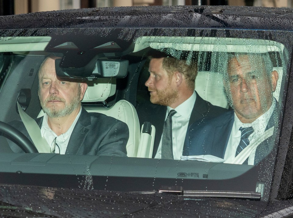Prince Harry in a car leaving Clarence House.
