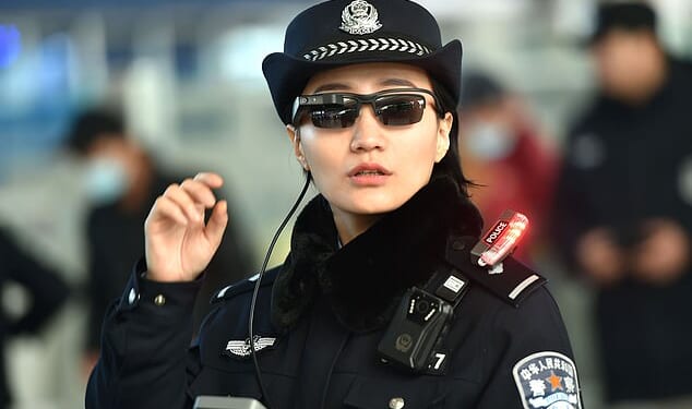 This photo taken on February 5, 2018 shows a police officer wearing a pair of smartglasses with a facial recognition system at Zhengzhou East Railway Station in Zhengzhou in China's central Henan province