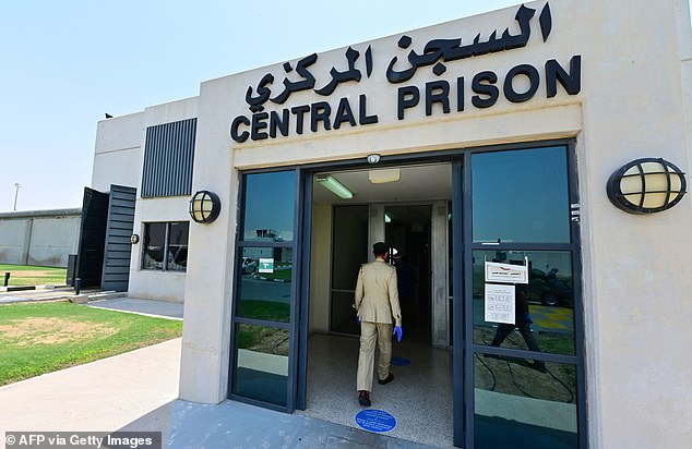 A policeman enters Dubai's Al-Awir central prison in the United Arab Emirates, on May 21, 2020