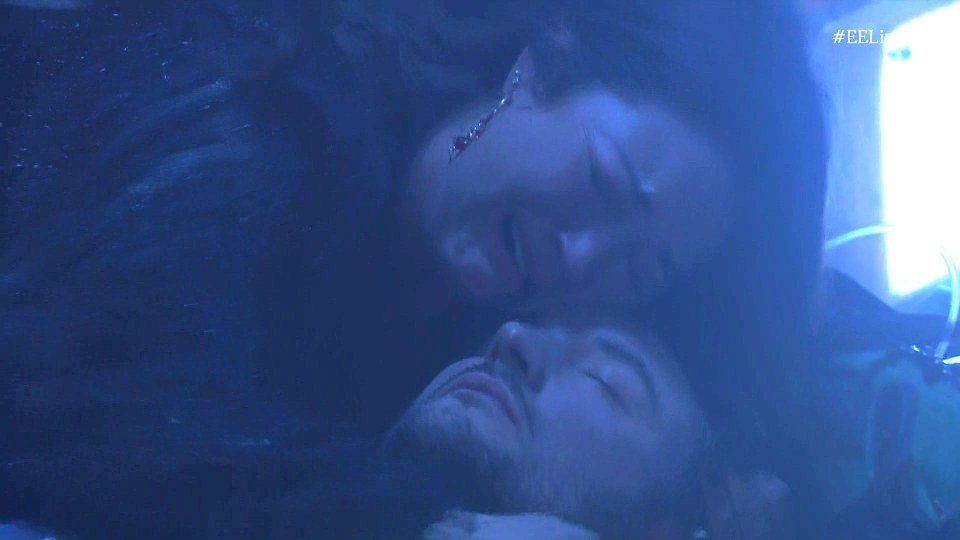 Martin Fowler's head lying on a dark surface, with a crying woman behind him.