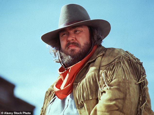 But the acting legend's vibrant life and career would be prematurely cut short. In 1994 he was cruelly struck down by a massive heart attack aged just 43, leaving behind a young family and a world in mourning (pictured in his final days filming Wagons East)