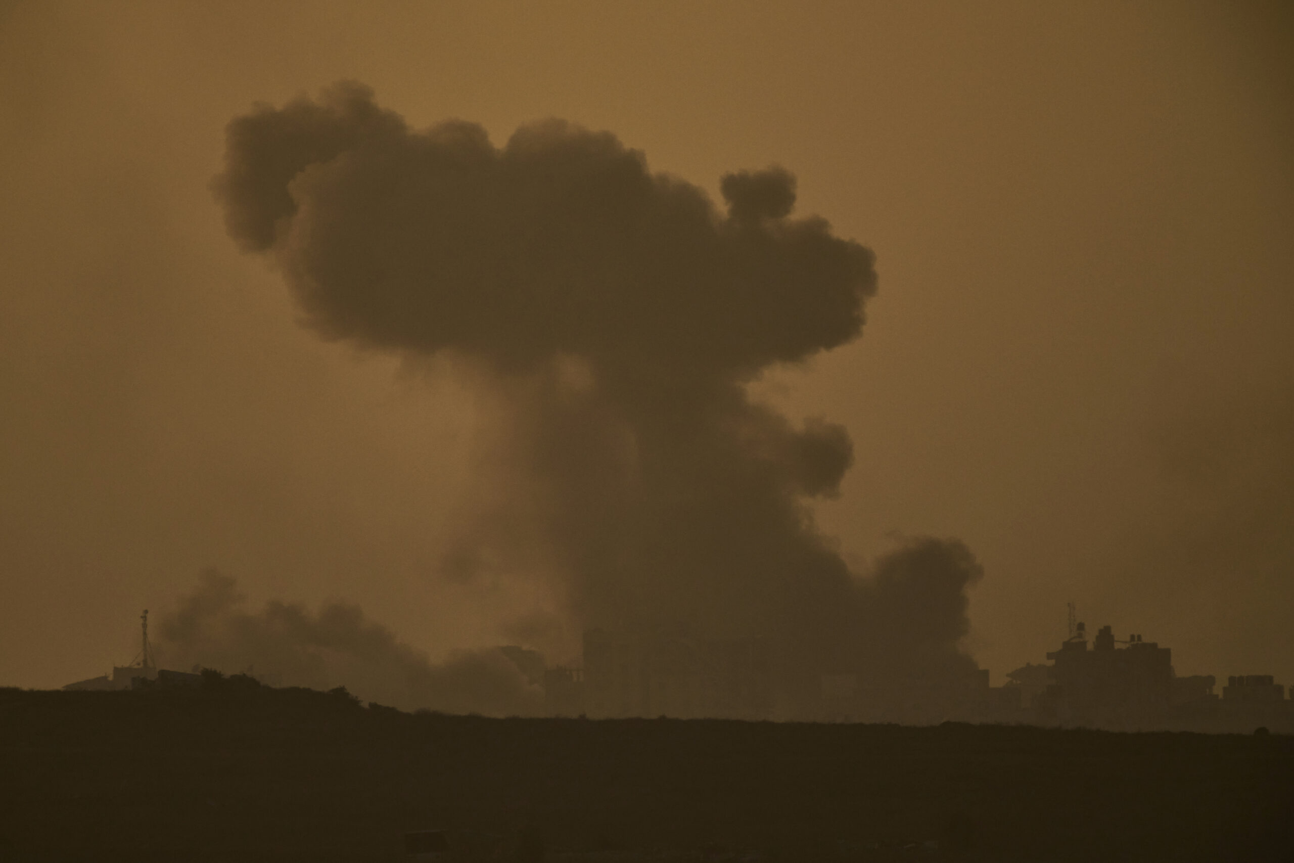 Smoke rises to the sky following an Israeli military strike in the Gaza Strip, as seen from southern Israel on Monday, Sept. 15, 2025.
