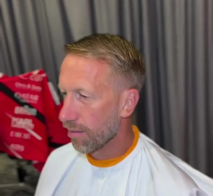 Graham Potter getting a haircut.