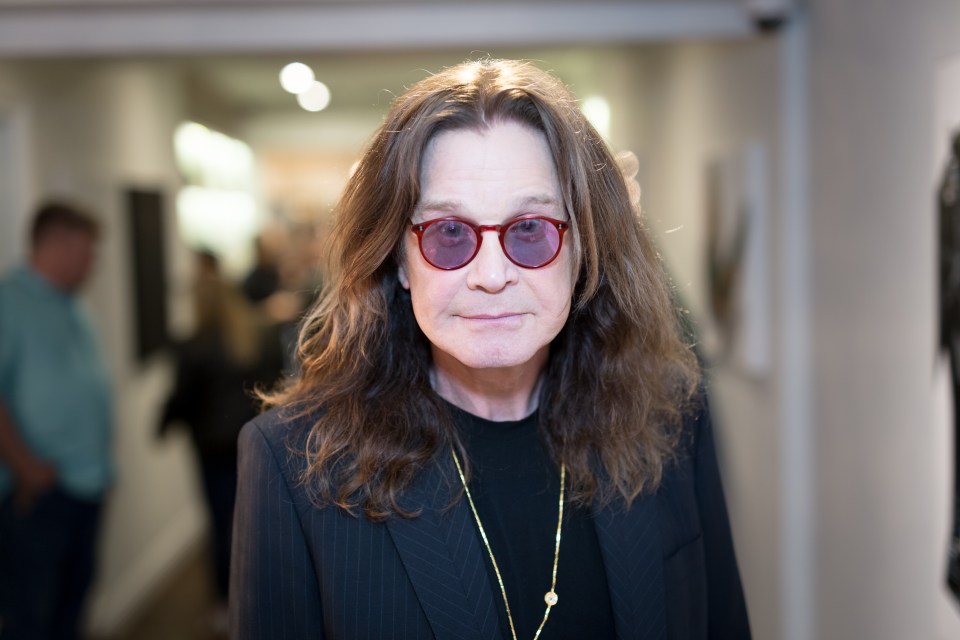 Ozzy Osbourne at an art exhibition.