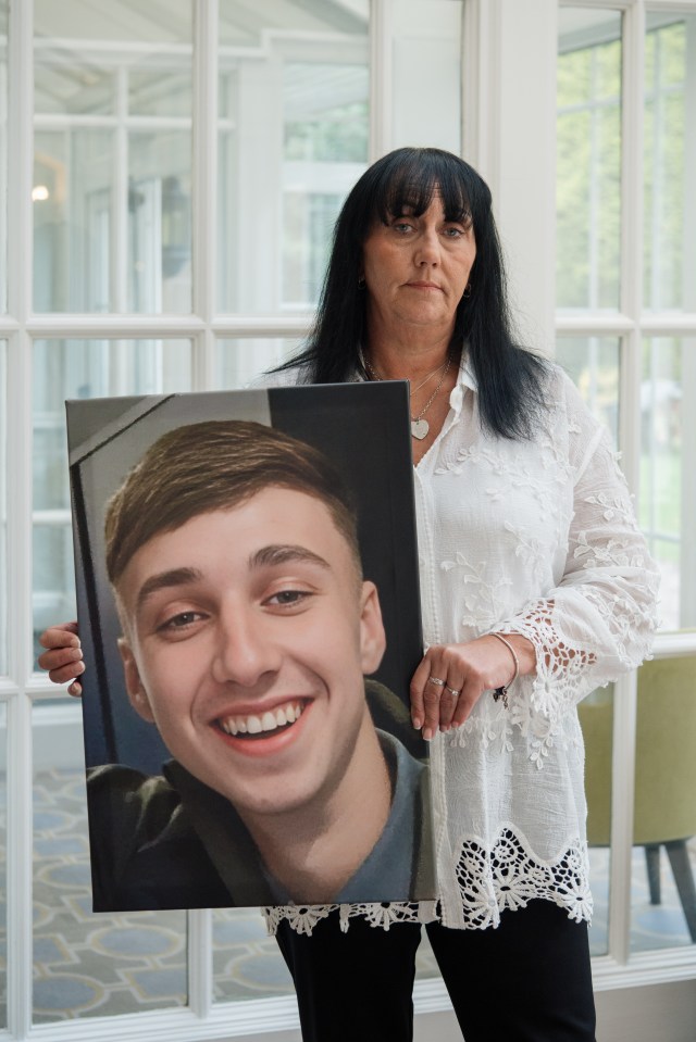 Debbie Duncan holding photo of Jay.