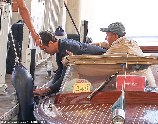 Jude Law was unable to keep his balance on a boat in Venice on Monday as he tumbled over after attending the 82nd Film Festival