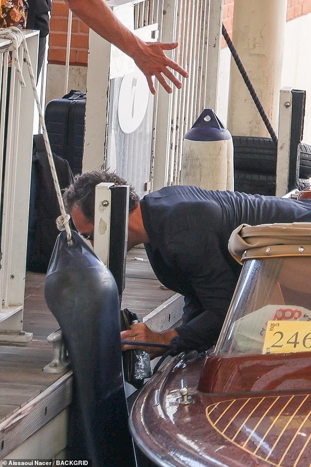 The actor, 52, was heading to the airport with wife Phillippa Coan when he slipped over and nearly face planted the dock while climbing off the taxi boat