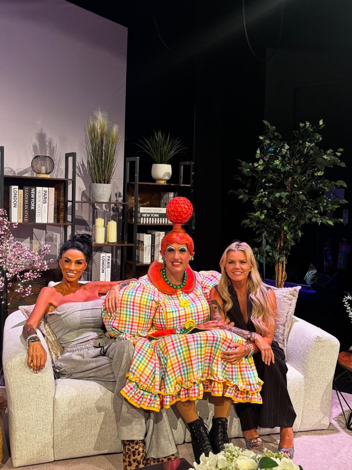 Three women sitting on a couch with a man in drag.