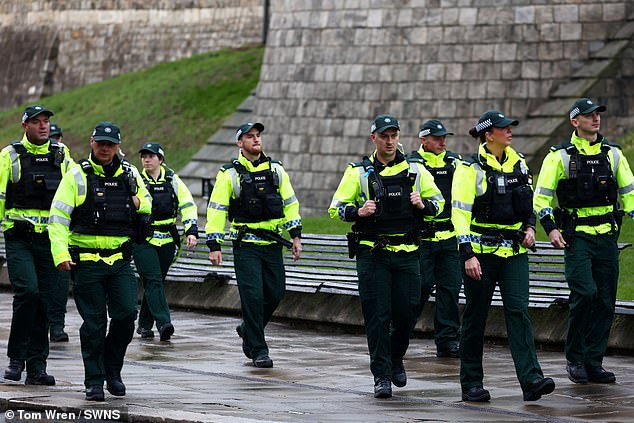 Police officers patrol in Windsor this morning as the state visit gets underway
