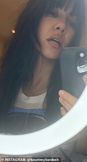 The 46-year-old mother-of-four debuted freshly cut bangs as she posed two mirror selfies for her 217 million followers to see