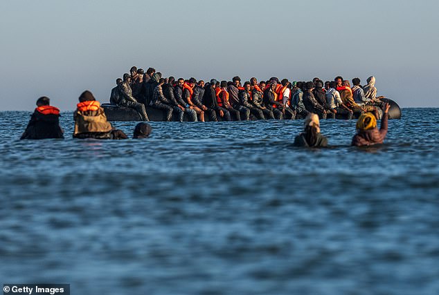 Shadow Home Secretary Chris Philp said: ¿This year so far has been the worst in history for Channel crossings¿. Pictured: Migrants board a dinghy heading across the Channel to England at the end of August