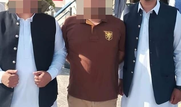 Questions have been raised over Birmingham councillor Saqib Khan's suitability for office after he was pictured at the wedding of his fugitive brother in Pakistan (right)
