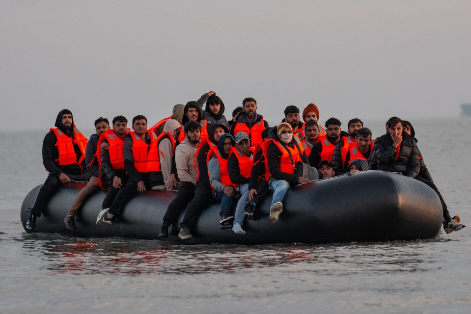 Migrants in a small boat crossing the English Channel.
