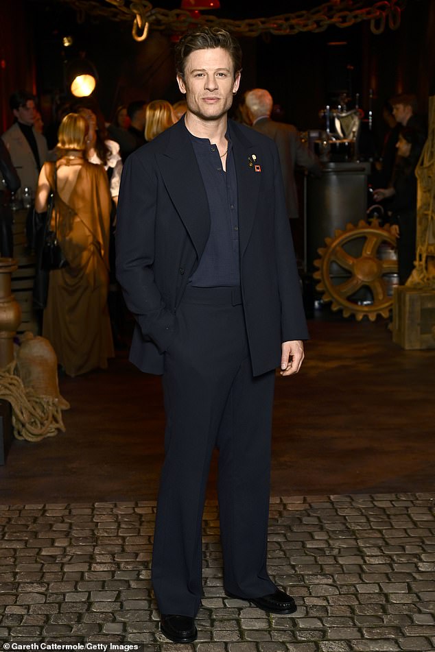 James, 40, looked as dashing as ever for Tuesday's premiere, exuding leading man charisma in a tailored dark navy suit with a matching blue button-up underneath and patent leather loafers