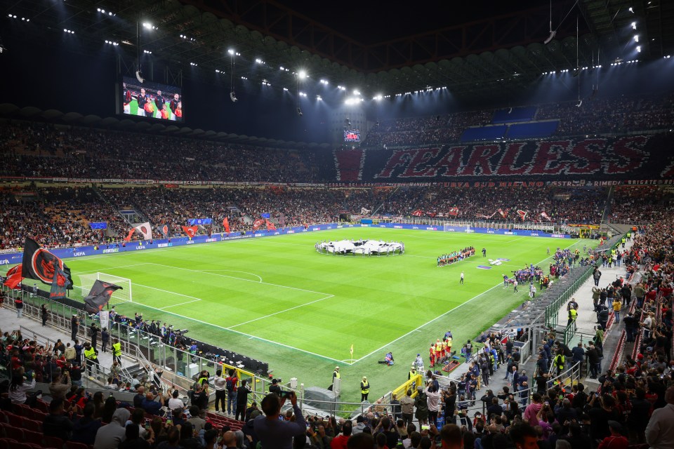 a soccer field with a banner that says fearless on it