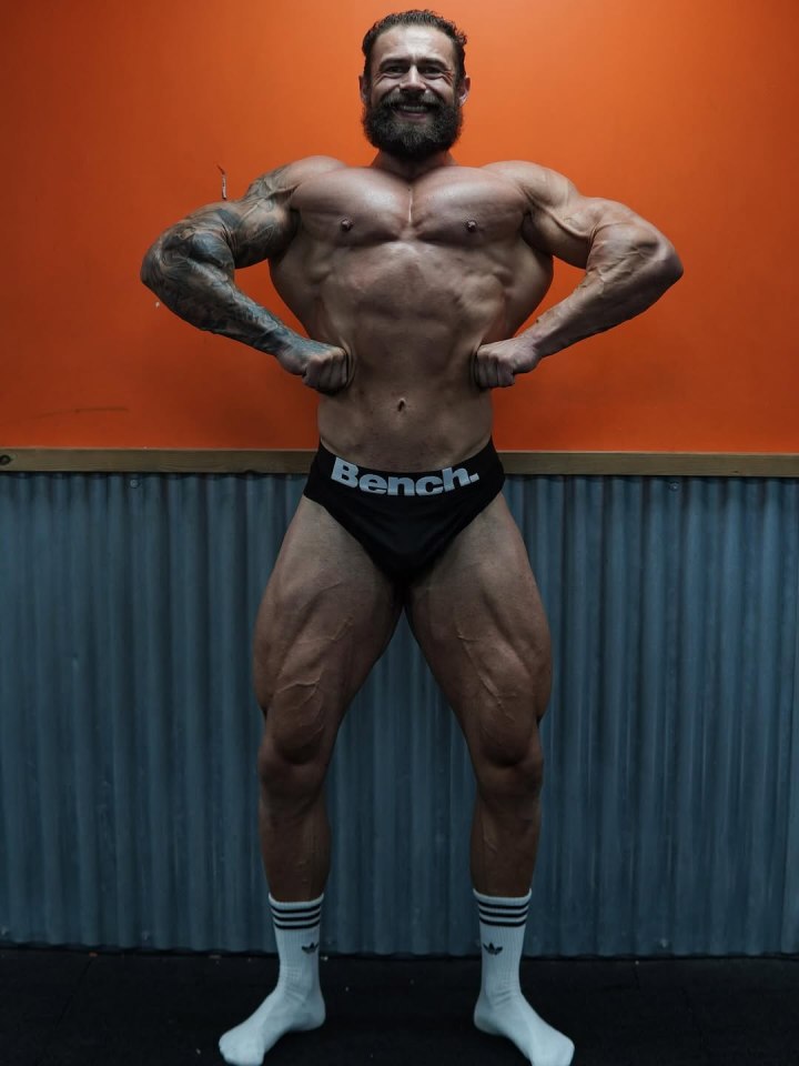 A muscular man posing.