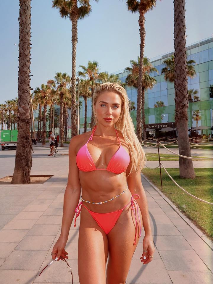 Gabby Allen in a pink bikini in Spain.