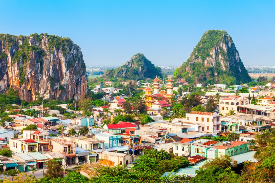 Aerial view of Da Nang Marble Mountains and surrounding town in Vietnam.