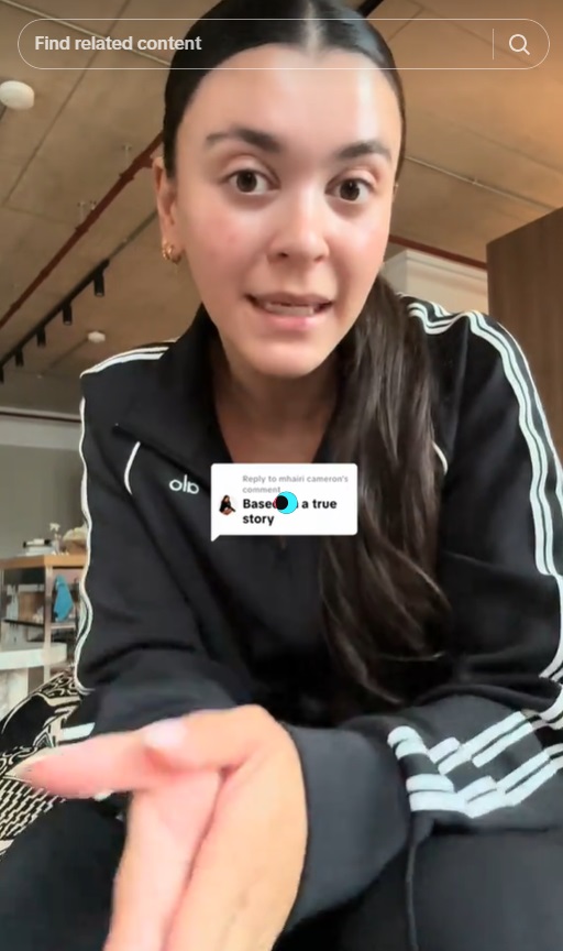 A woman in a black jacket speaking to the camera with a caption bubble that reads, "Based on a true story."