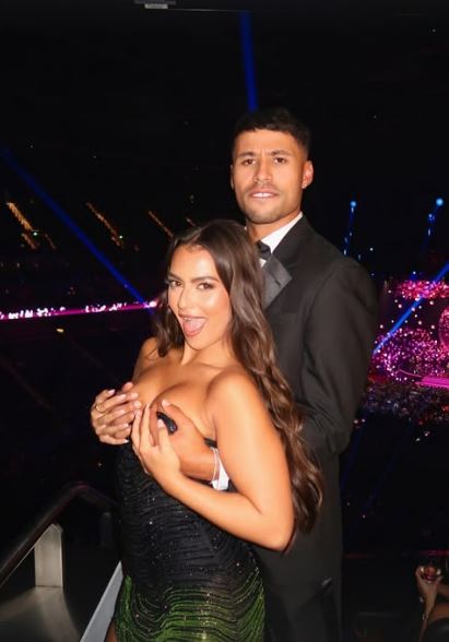 Conor from Love Island grabbing his girlfriend's breasts.