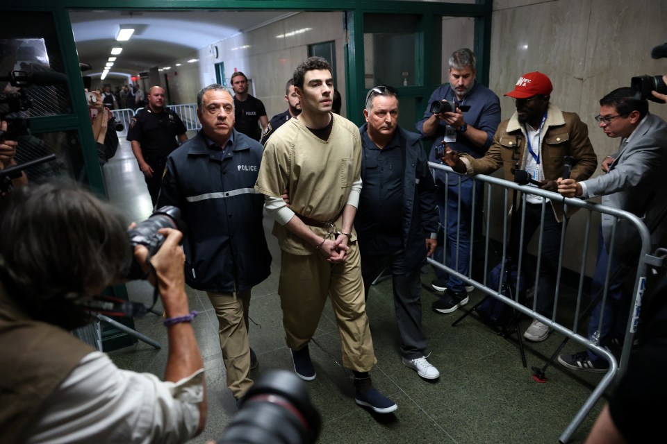 Luigi Mangione, the suspect in the killing of UnitedHealthcare chief executive Brian Thompson, walks at Manhattan Supreme Court on the day he appears on New York State murder and terrorism charges, in New York City.