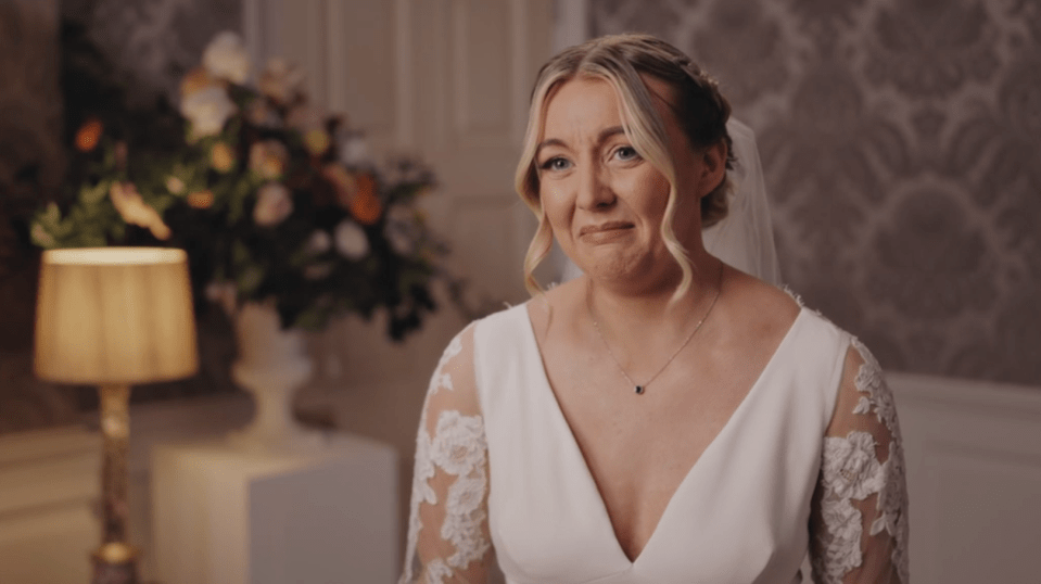 A bride crying and smiling on her wedding day.