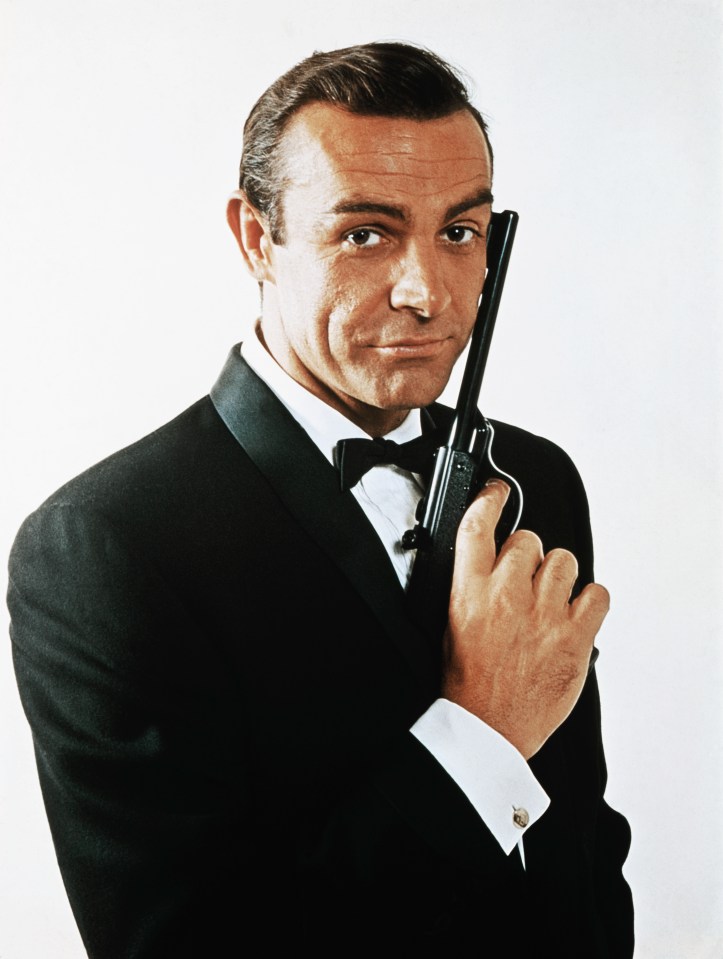 Portrait of Sean Connery as James Bond holding a gun.